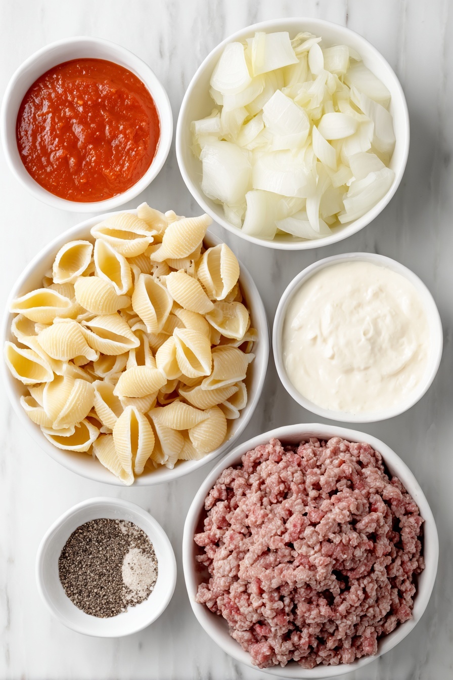 Flat lay of medium uncooked pasta shells, a small white bowl of olive oil, a halved medium yellow onion with one half chopped, a portion of fresh lean ground beef, three whole garlic cloves, a small white bowl of bright red tomato sauce, a small white bowl of rich beef broth, a small white bowl of creamy heavy whipping cream, and a small pile of coarse salt and whole black peppercorns, all arranged symmetrically on simple white ceramic bowls and plates, placed on a clean white marble surface, soft natural light, photo taken with an iPhone, professional food photography style, fresh ingredients, white ceramic bowls, no bottles, no duplicates, no utensils, no packaging --ar 2:3 --v 7 --p m7354615311229779997